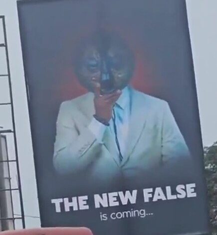 Mysterious "THE NEW FALSE" Billboard in Kaneshie, Accra, Fuels Speculation and Intrigue